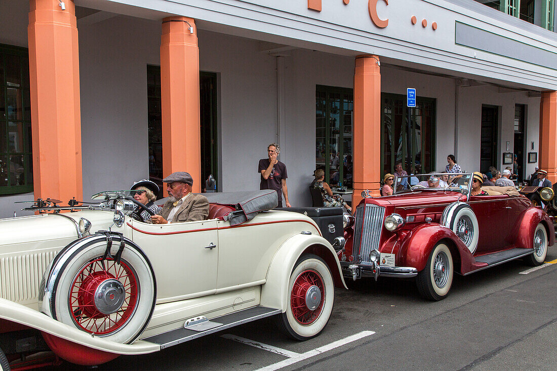 Art Deco Festival, vintage cars parked in front of Masonic Hotel, Napier, Hawke's Bay, North Island, New Zealand