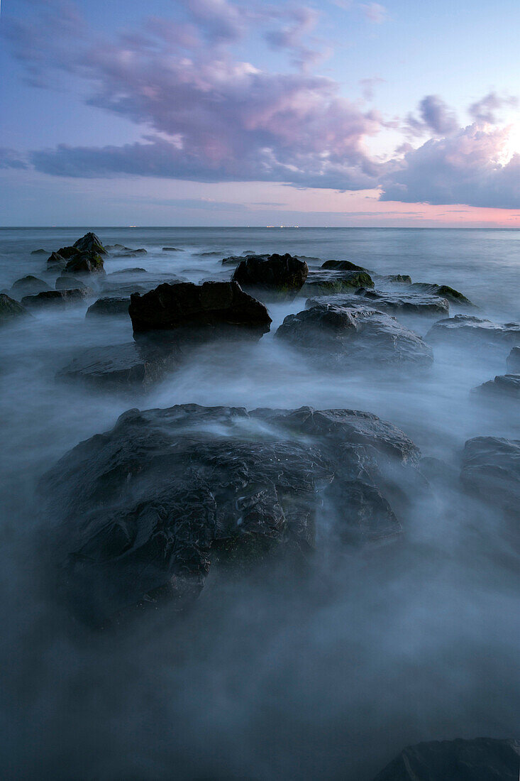 Fog on rocks at ocean
