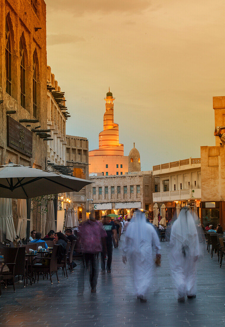 Blurred view of people walking on Doha street, Doha, Qatar