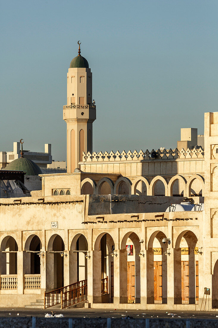 Ornate building and tower under blue sky, Doha, Qatar