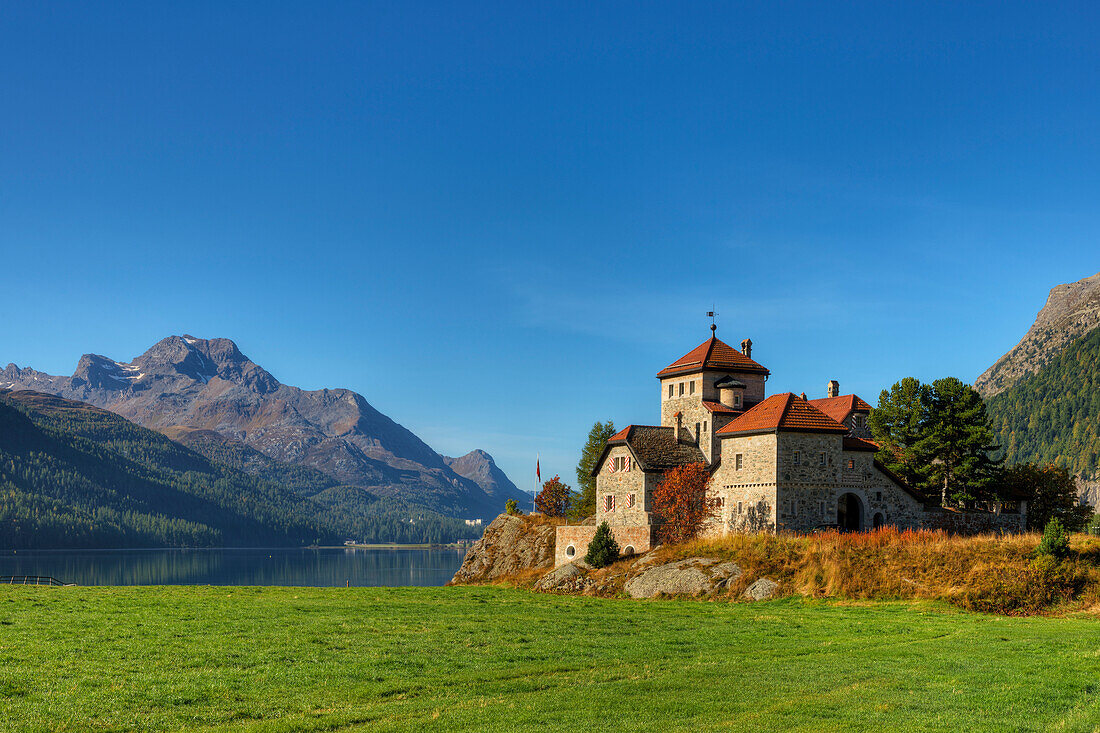 Crap da Sass castle with Lake Silvaplana and Piz da la Margna, Engadine, Canton Grisons, Switzerland