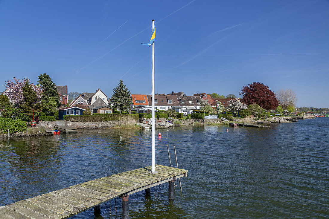 Houses and jetty by the Schlei in Schleswig, Baltic coast, Schleswig-Holstein, Northern Germany, Germany, Europe