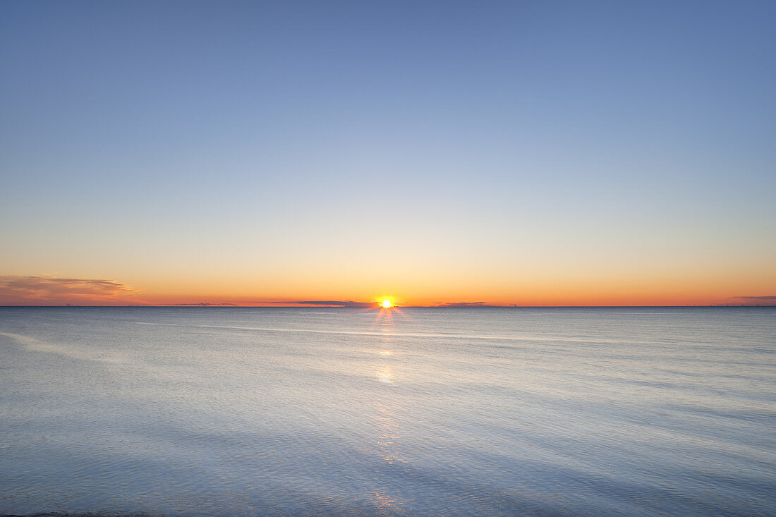 Sunset over Baltic Sea, Dranske, Peninsula Wittow, Island Ruegen, Baltic Sea coast, Mecklenburg-Western Pomerania, Northern Germany, Germany, Europe