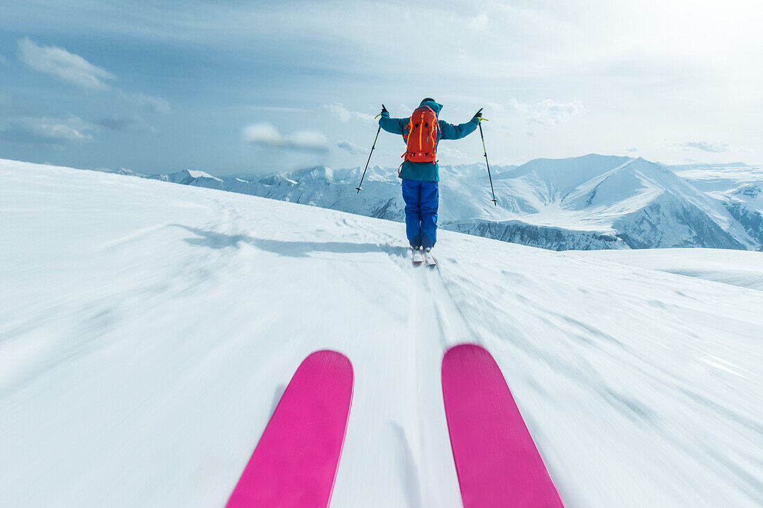 Two young male skiers riding down apart the slopes, Gudauri, Mtskheta-Mtianeti, Georgia