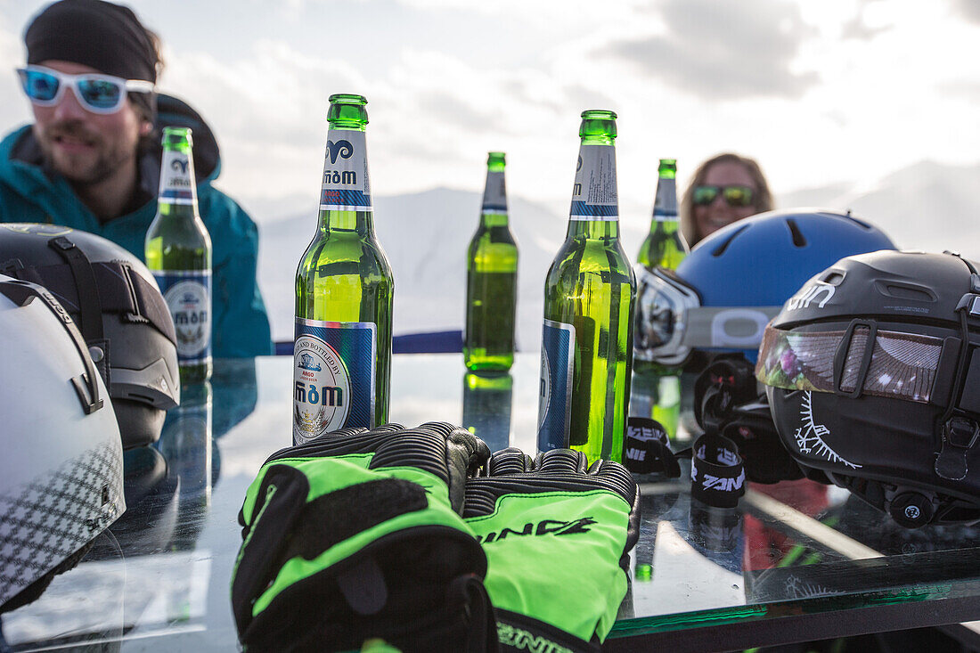 Two skiers relaxing in a ski resort, Gudauri, Mtskheta-Mtianeti, Georgia