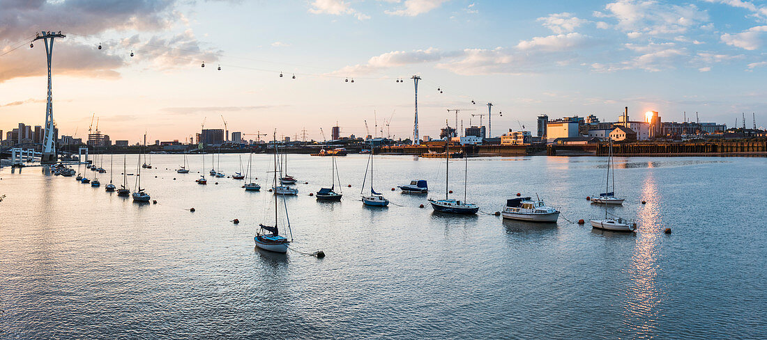 River Thames at sunset and the Emirates Air Line Cable Car, East London, England, United Kingdom, Europe