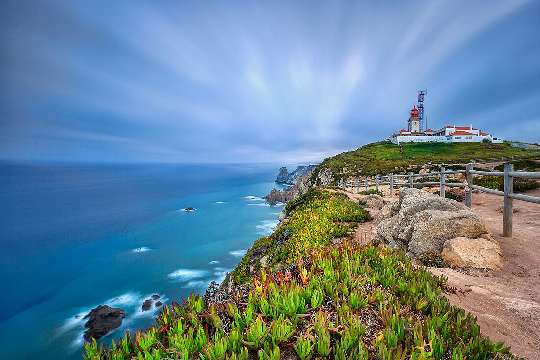 Sunrise on the cape and lighthouse of Cabo da Roca overlooking the Atlantic Ocean, Sintra, Portugal, Europe