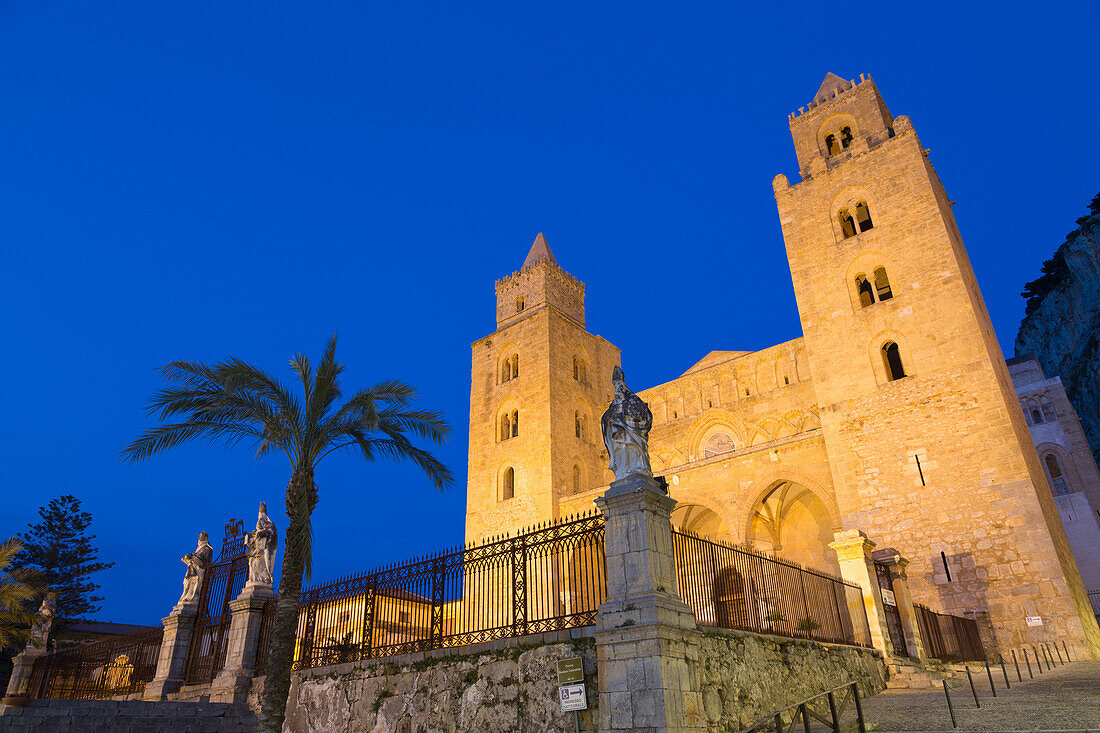 The facade of the Norman Cathedral of Cefalu illuminated at night, Sicily, Italy, Europe