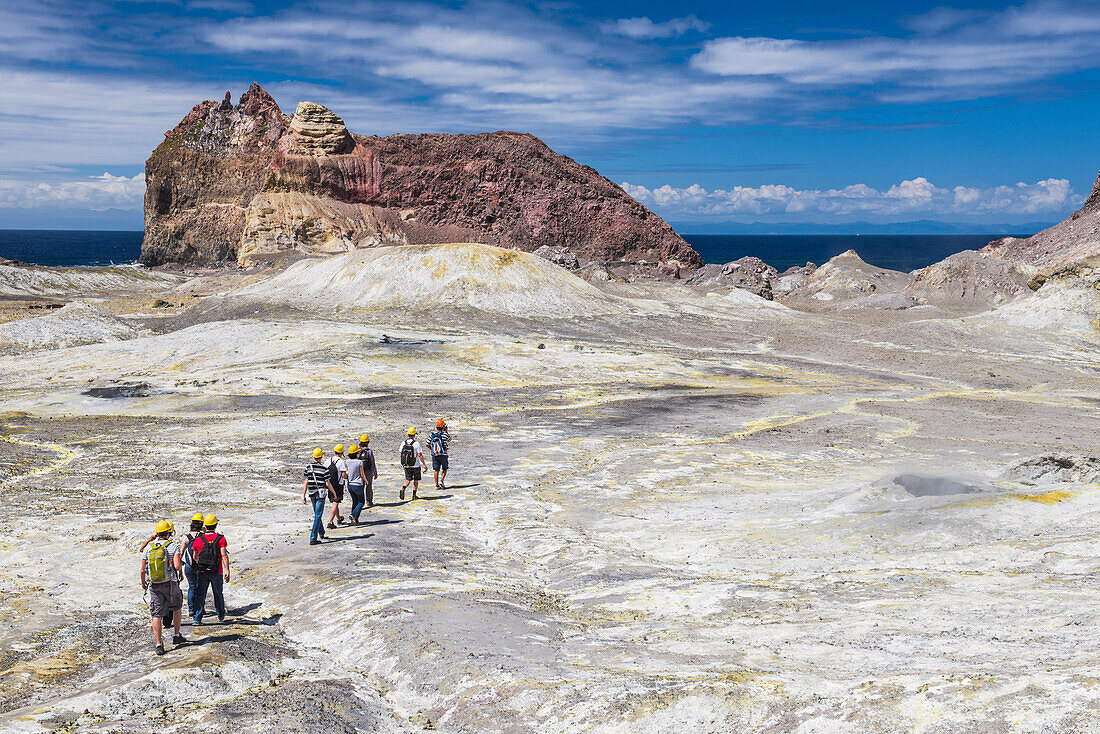 Tourists exploring White Island Volcano, an active volcano in the Bay of Plenty, North Island, New Zealand, Pacific