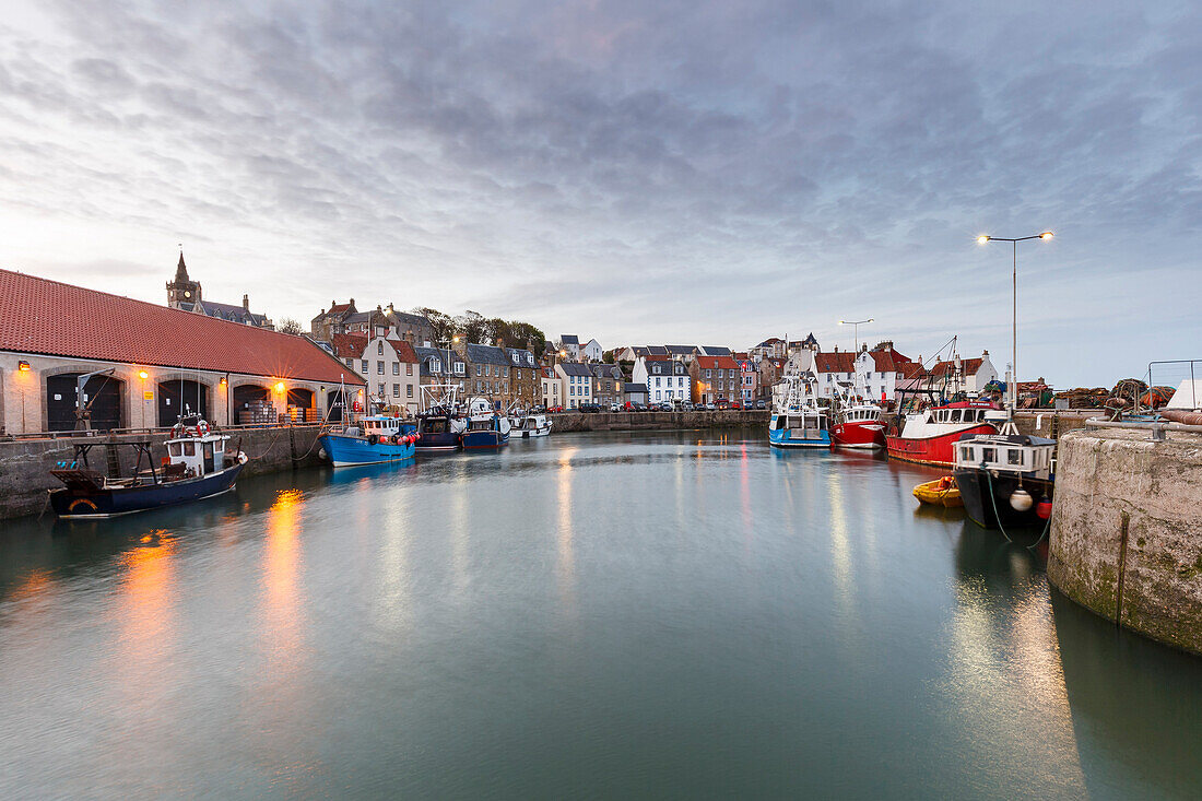 Fishing boats at dusk in the harbour at Pittenweem, Fife, East Neuk, Scotland, United Kingdom, Europe