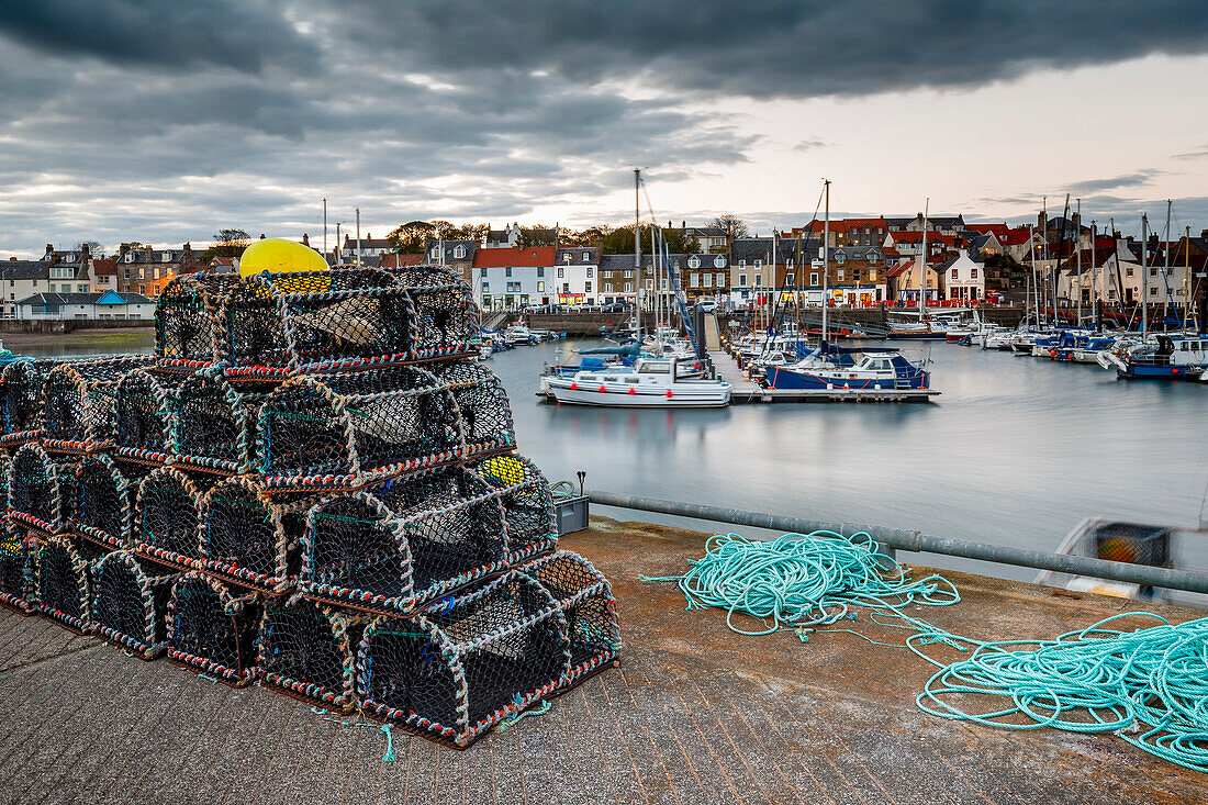 Sailing boats and crab pots at dusk in the harbour at Anstruther, Fife, East Neuk, Scotland, United Kingdom, Europe