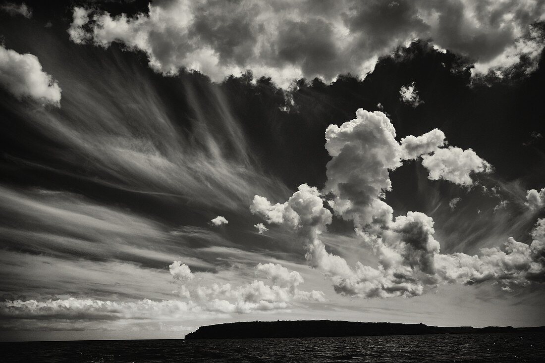 Silhouette of the northern coast of Minorca and clouds, Mediterranean Sea, Balearic Islands, Spain