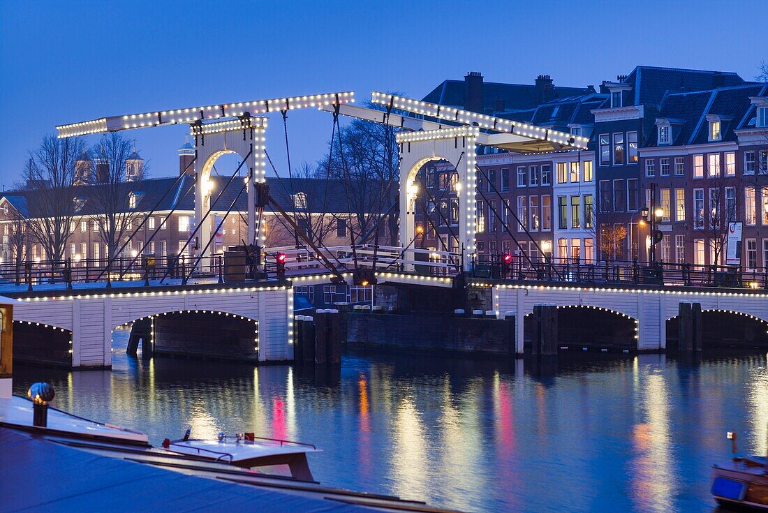 Netherlands, Amsterdam, Magere Brug, the Skinny Bridge, dusk.