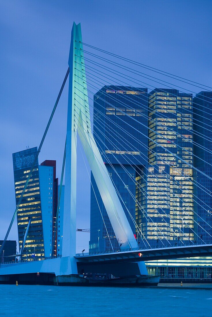 Netherlands, Rotterdam, Erasmusbrug bridge and new commerical towers at the renovated docklands, dawn.