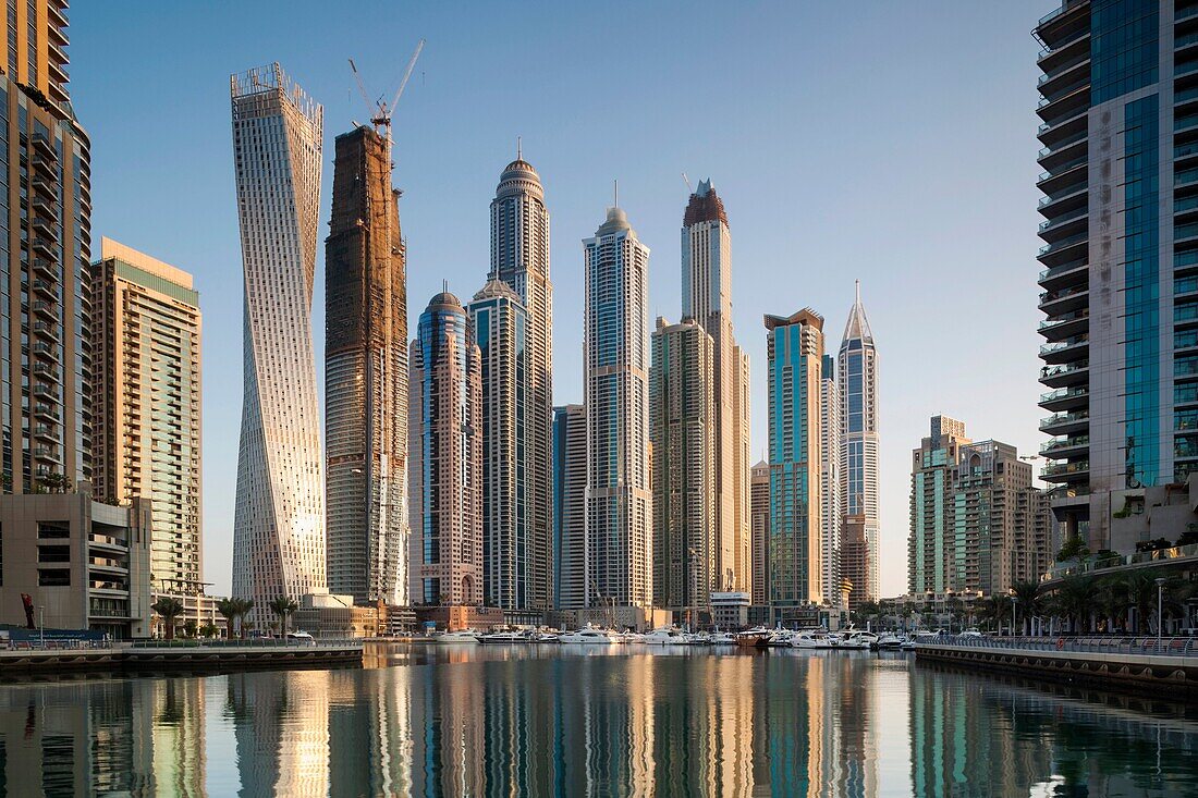 UAE, Dubai, Dubai Marina, high rise buildings including the twisted Cayan Tower, morning.