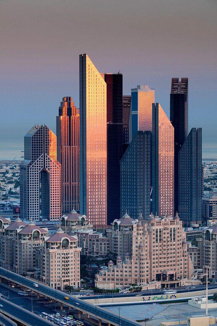 UAE, Dubai, Downtown Dubai, elevated view of skyscrapers on Sheikh Zayed Road from downtown, dawn.