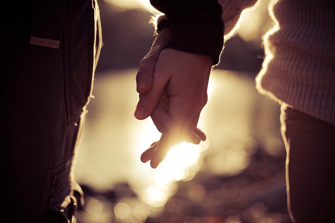 Young couple holding hands.