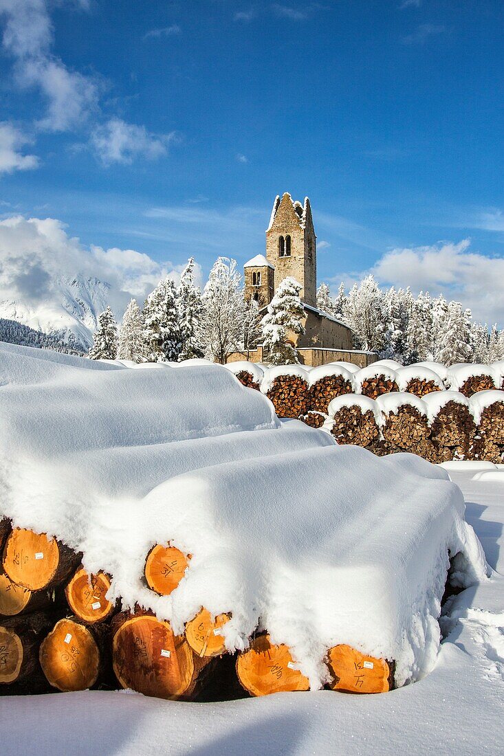 The church of San Gian surrounded by snowy woods Celerina Canton of Grisons Engadine Switzerland Europe.