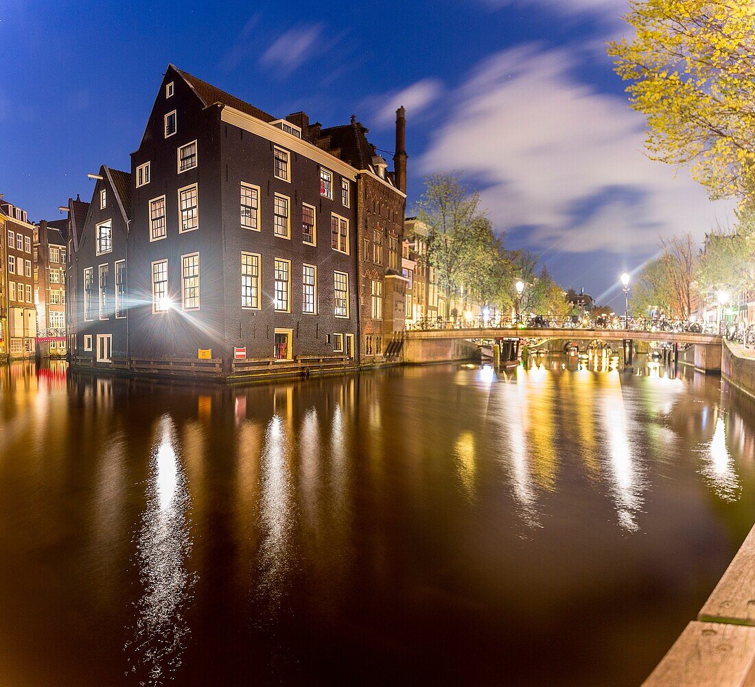 Amsterdam, houses reflecting on canal, Netherlands, Europe.