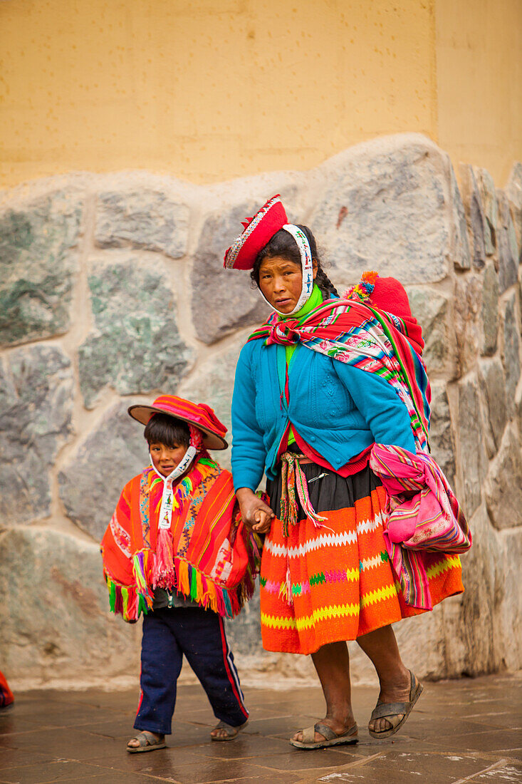 Traditional Peruvian Incan woman and her son, Ollantaytambo, Peru, South America