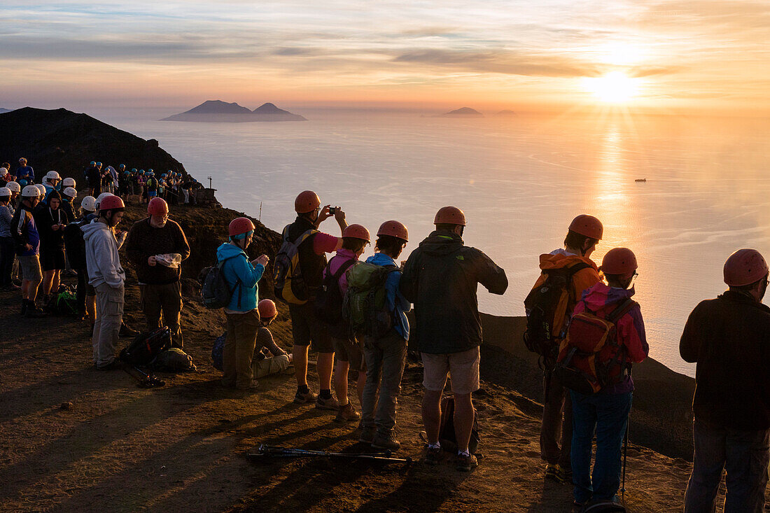 tourists on the summit of Stromboli Volcano at sunset, Stromboli Island, Aeolian Islands, Lipari Islands, Tyrrhenian Sea, Mediterranean Sea, Italy, Europe