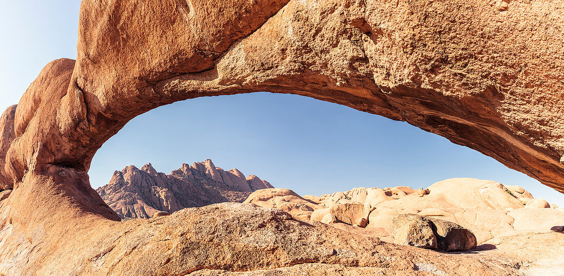 Pontok mountains, seen through a rock arch, Spitzkoppe, Erongo, Namibia