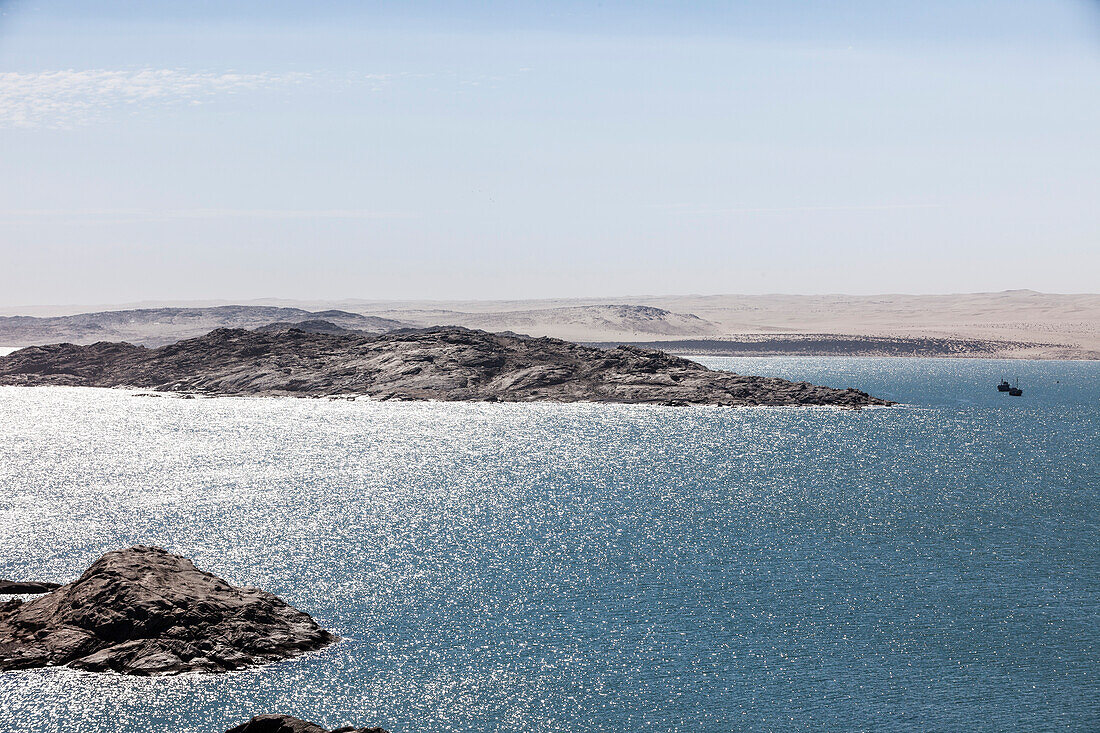 Penguin Island and Seal Island, desert in the background, Luederitz, Karas, Namibia.