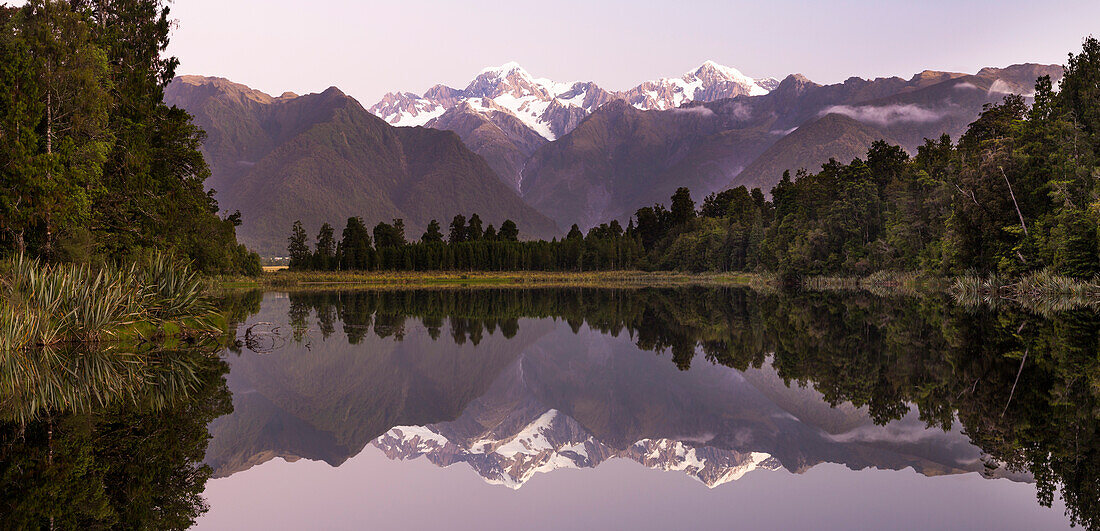 Reflection in the water, Lake Matheson, Mount Cook, Mount Cook, Westland Tai Poutini National Park, West Coast, South Island, New Zealand, Oceania