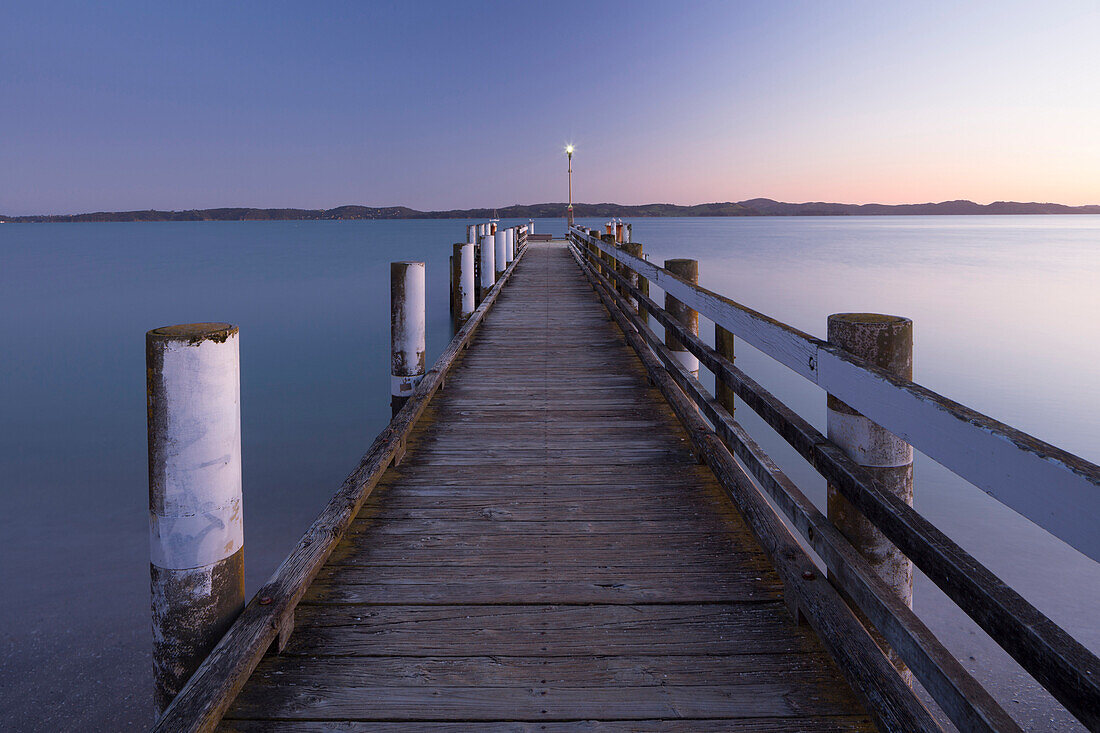 Wooden Jetty at dusk, Maraetai, Auckland, North Island, New Zealand, Oceania