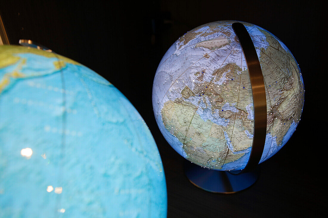 Globes in a book shop, Munich, Upper Bavaria, Bavaria, Germany