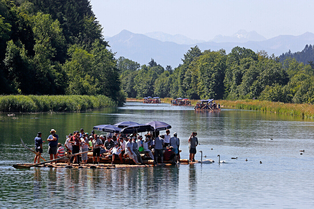 People on a traditional wood raft, river Isar, Munich, Upper Bavaria, Bavaria, Germany