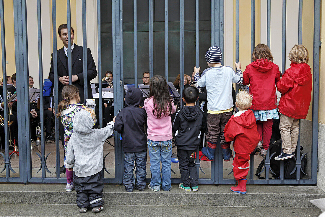 Children listening to a concert in the entrance hall of St. Josef's church, Josefsplatz, Maxvorstadt, Munich, Upper Bavaria, Bavaria, Germany