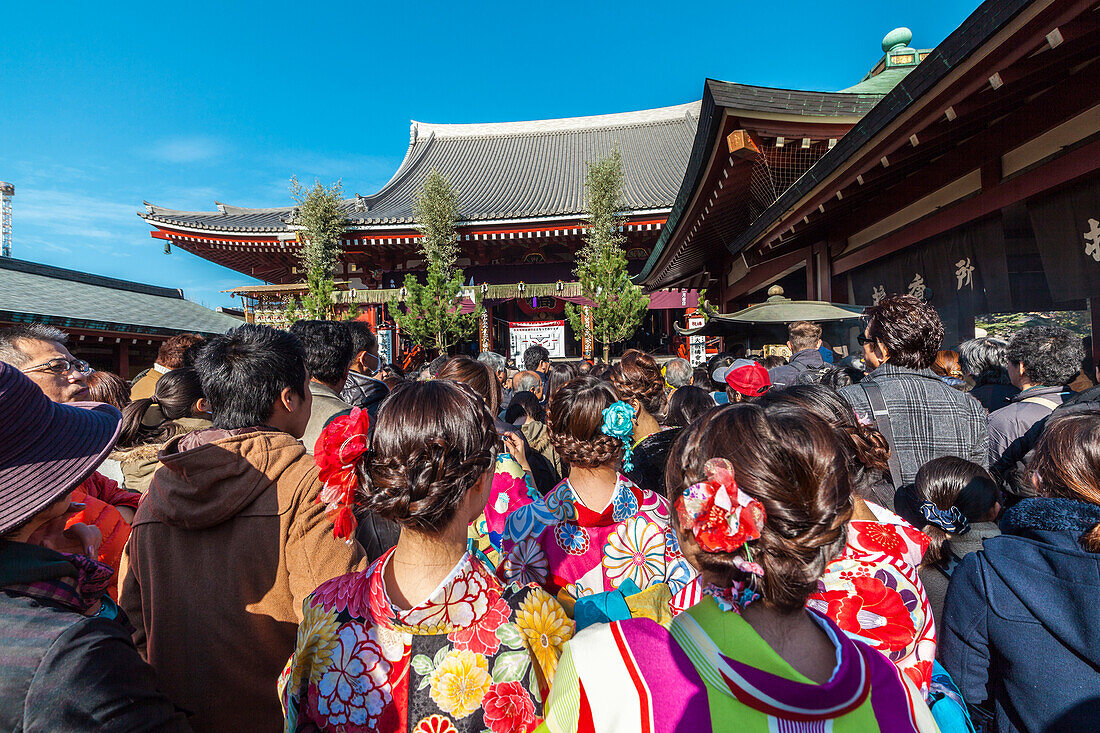 Young Japanese women wearing kimono in front of temple Senso-ji in Asakusa during new year, Taito-ku, Tokyo, Japan