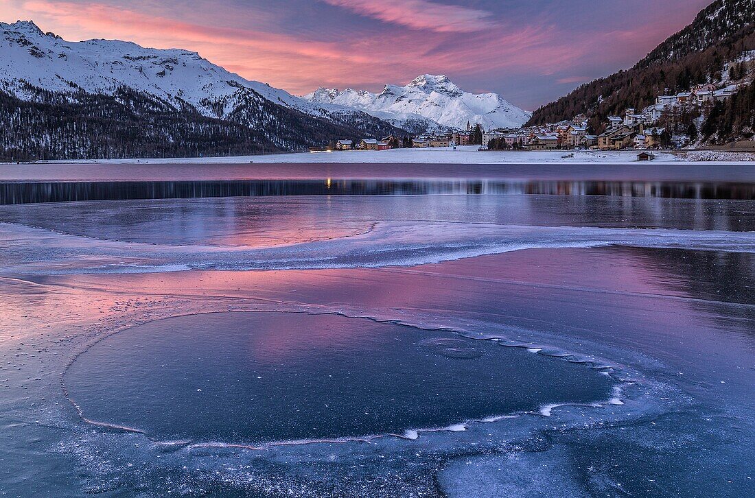 Silvaplana Lake, Sankt Moritz, Switzerland. Sunset over the frozen lake.
