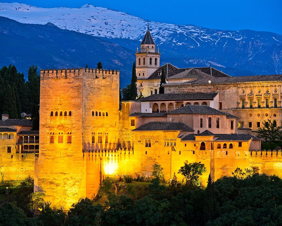 Evening light at the Alhambra, UNESCO World Heritage Site, against the Sierra Nevada mountain range, Granada, Andalusia, Spain.