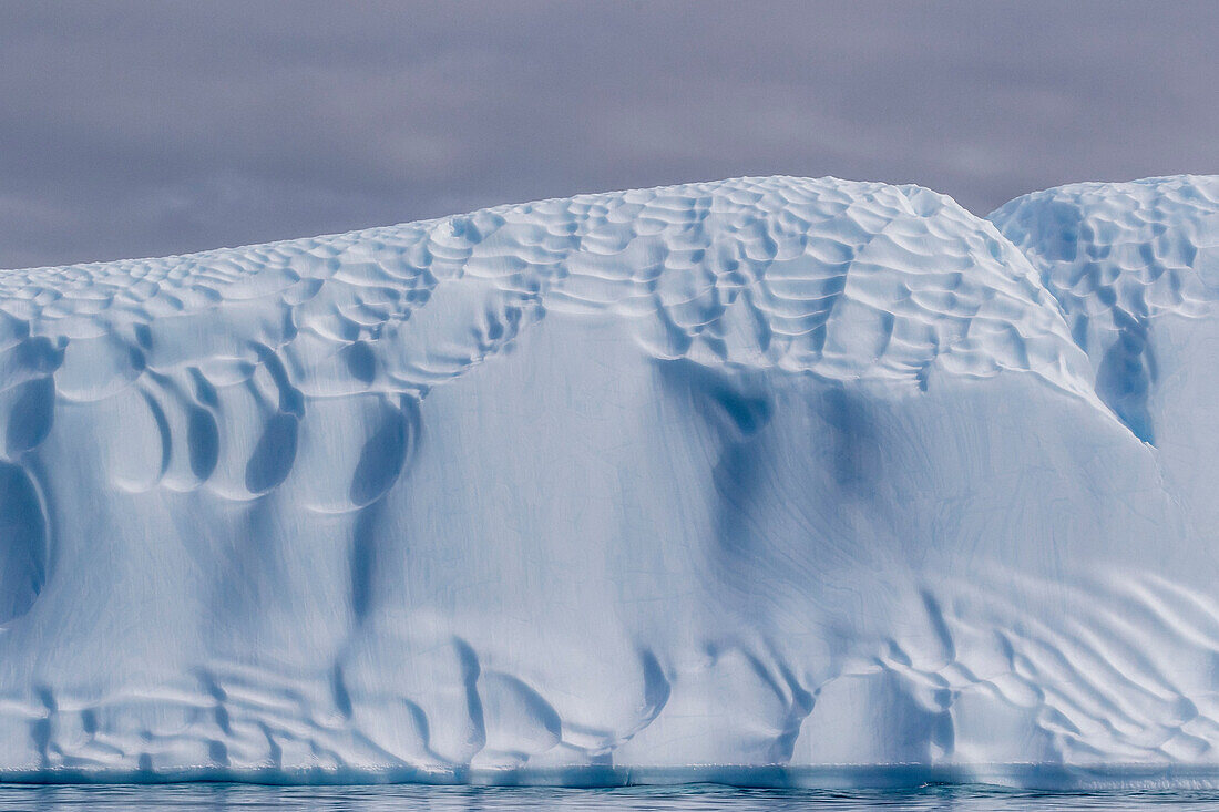 Sculpted iceberg at Booth Island, Antarctica.