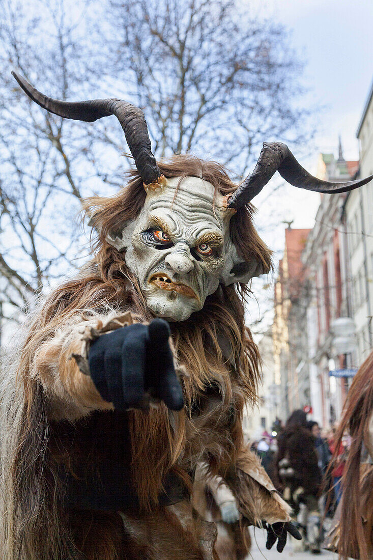 Krampuslauf or Perchtenlauf during advent in Munich, an old tradition taking place during christmas time in the alps of Bavaria, Austria and South Tyrol. The Munich Krampuslauf is a huge event and attraction, where Krampus groups from all over the alps ar