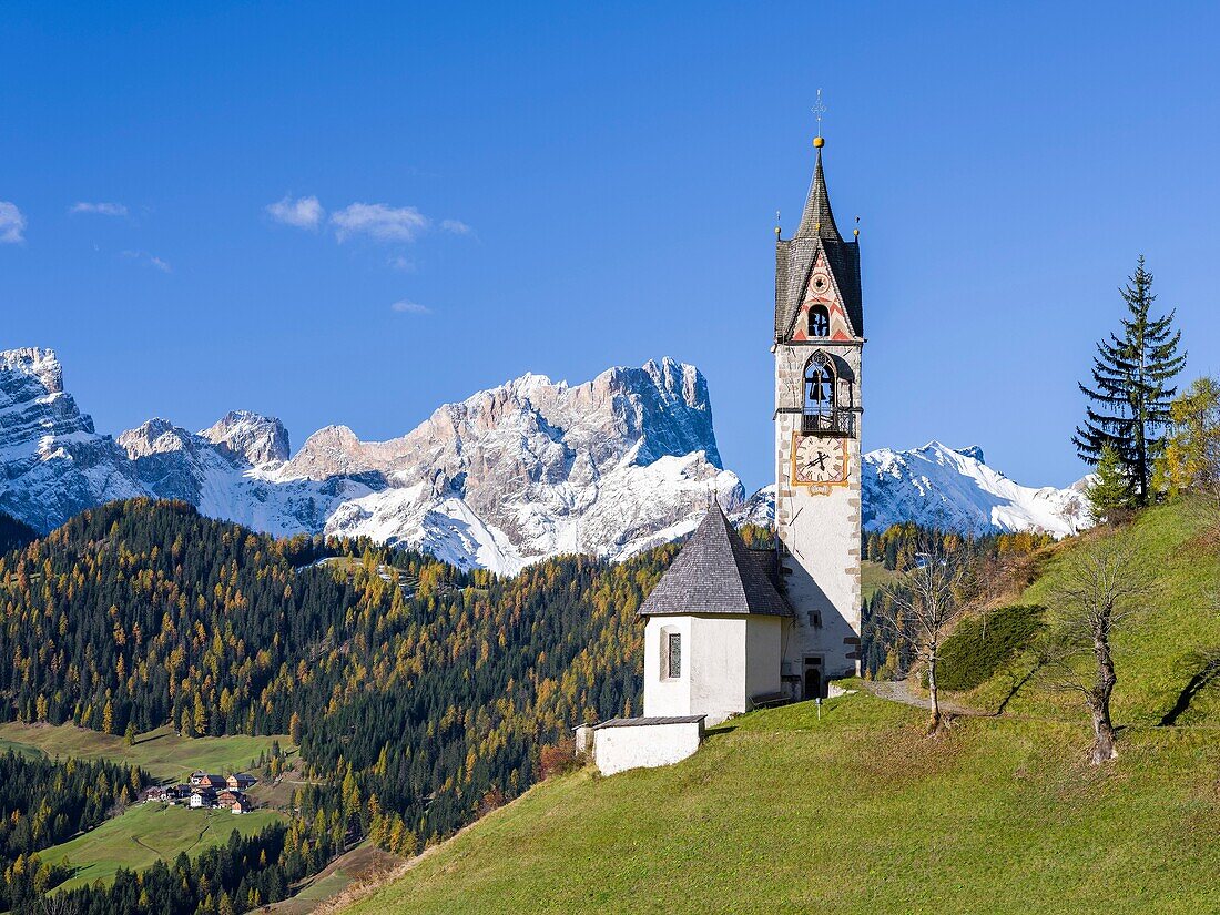 Chapel Barbarakapelle - Chiesa di santa Barbara in the village of Wengen - La Valle, in the Gader Valley - Alta Badia in the Dolomites of South Tyrol - Alto Adige, Geisler - Odle mountain range in the background. The Dolomites are listed as UNESCO World h