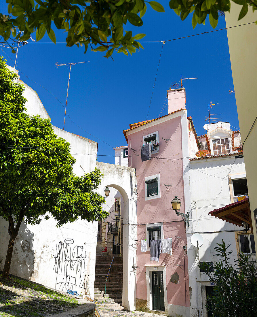 The narrow lanes of the Alfama, an old town dating back to moorish times. Lisbon (Lisboa) the capital of Portugal. Europe, Southern Europe, Portugal, March.