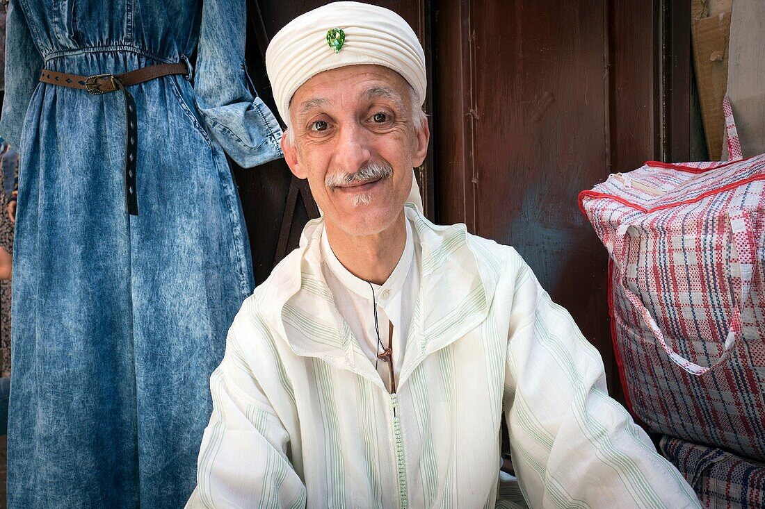 Portrait of man dressed in white djellaba. Fez, Morocco