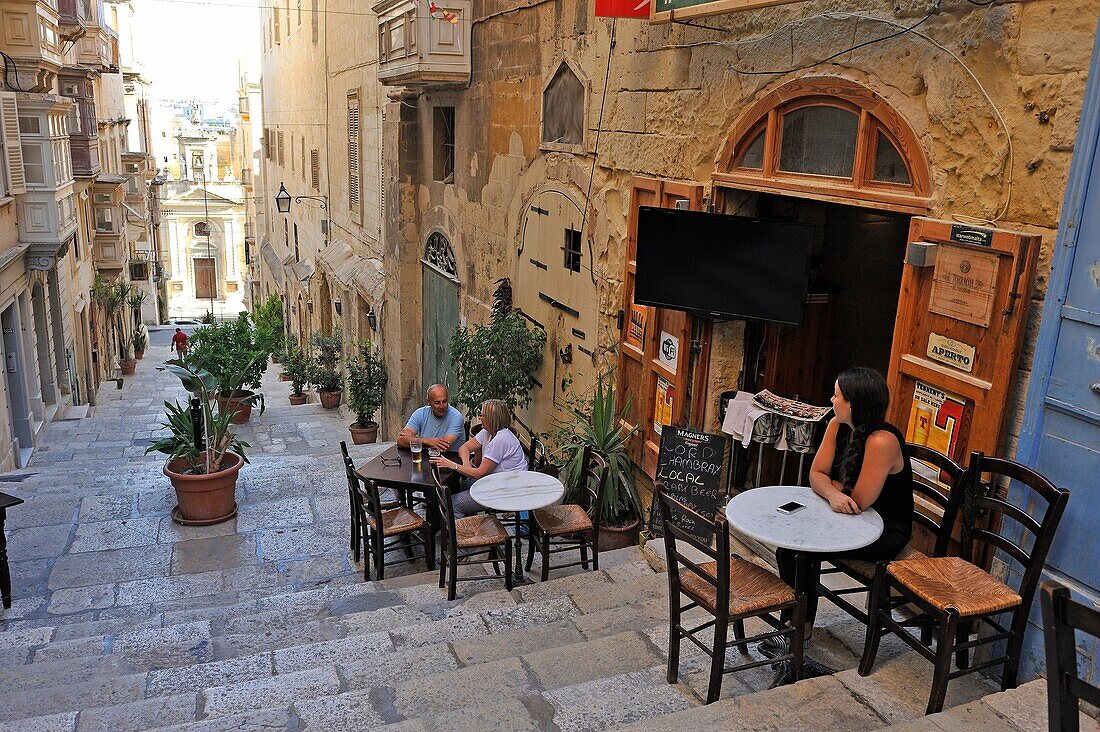 Terrace of San Paolo Naufrago cafe in St. Lucia's Street, Valletta, Malta, Southern Europe.