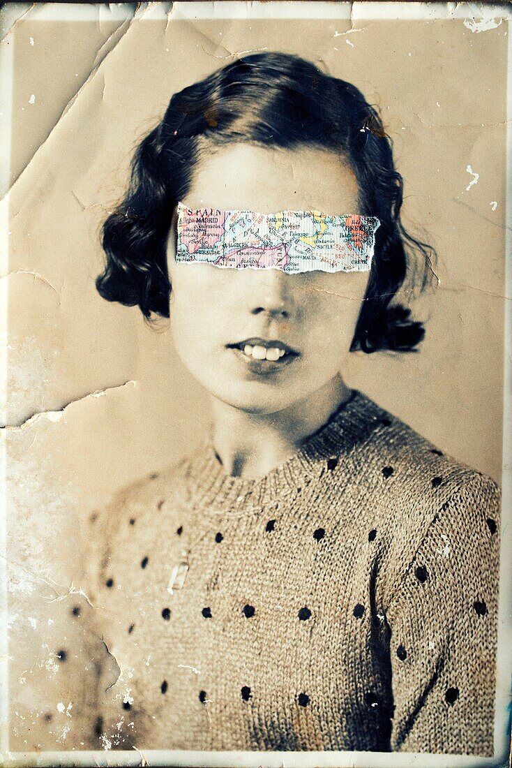 Antique portrait of young woman looking at the camera, with a map fragment covering her eyes