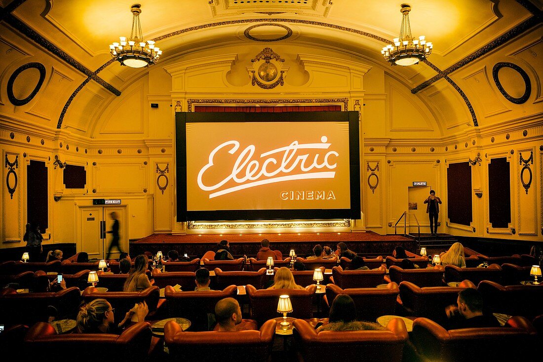 Interior of Electric Cinema with people sitting in armchairs, Portobello Rd. London, England