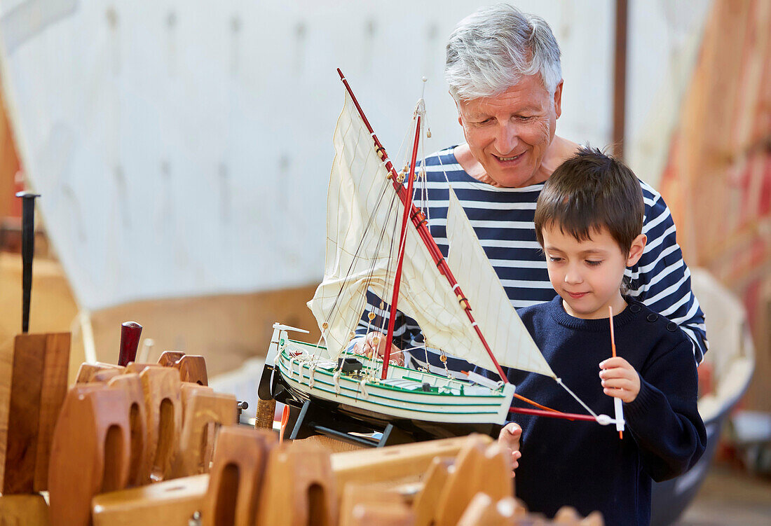 Grandfather and grandson, Building model sailboat, Whaleship, Pasaia, Gipuzkoa, Basque Country, Spain, Europe