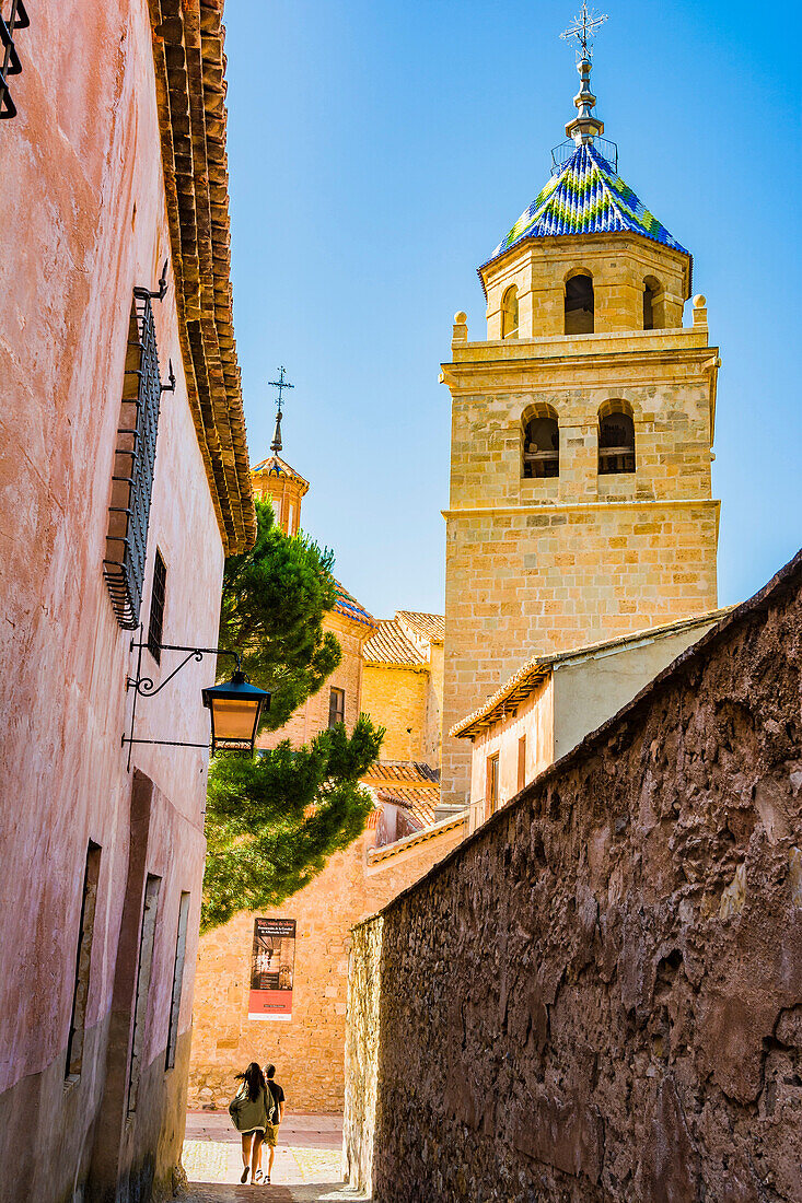 The bell tower of the Cathedral of San Salvador stands out among the roofs of Albarracin buildings. Albarracin, Teruel, Aragón, Spain, Europe.