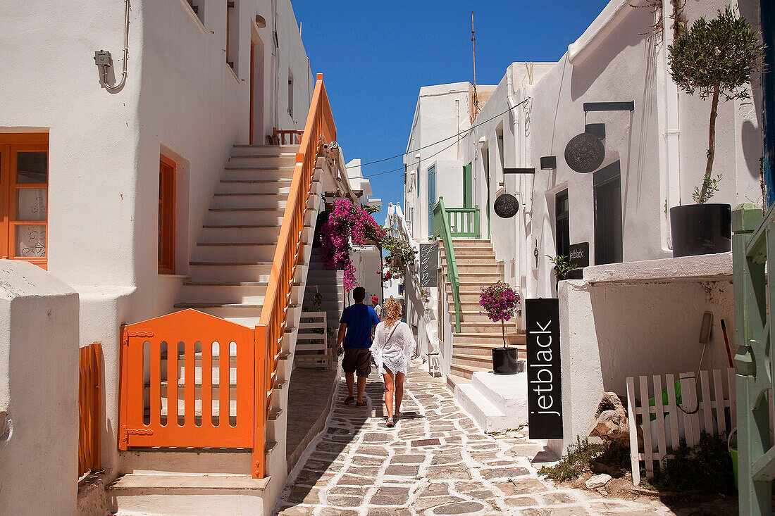 Tourists walking in the alleys of the town, Naoussa, Paros, Cyclades Islands, Greek Islands, Greece, Europe.