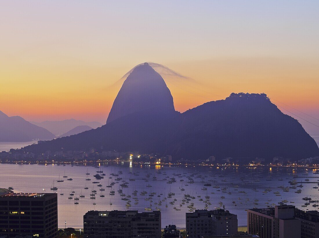 Brazil, City of Rio de Janeiro, View over Botafogo Neighbourhood towards the Sugarloaf Mountain at sunrise.