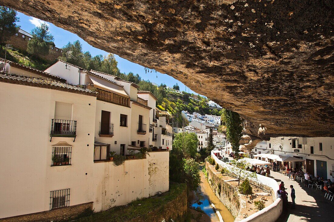 Typical terrace restaurants constructed in caves sit under huge rocks, Setenil de las Bodegas, White Towns, Pueblos Blancos, Cadiz province, Andalusia, Spain, Europe.