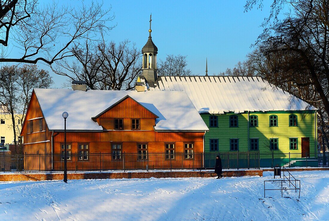 Winter scene, Open-air Museum of regional Wooden Architecture - integral part of Central Museum of Textiles, located on main artery of Lodz - Piotrkowska Street, next to the Wladyslaw Reymont Park, here church of Saint Andrew Bobola (Kosciol Swietego Andr