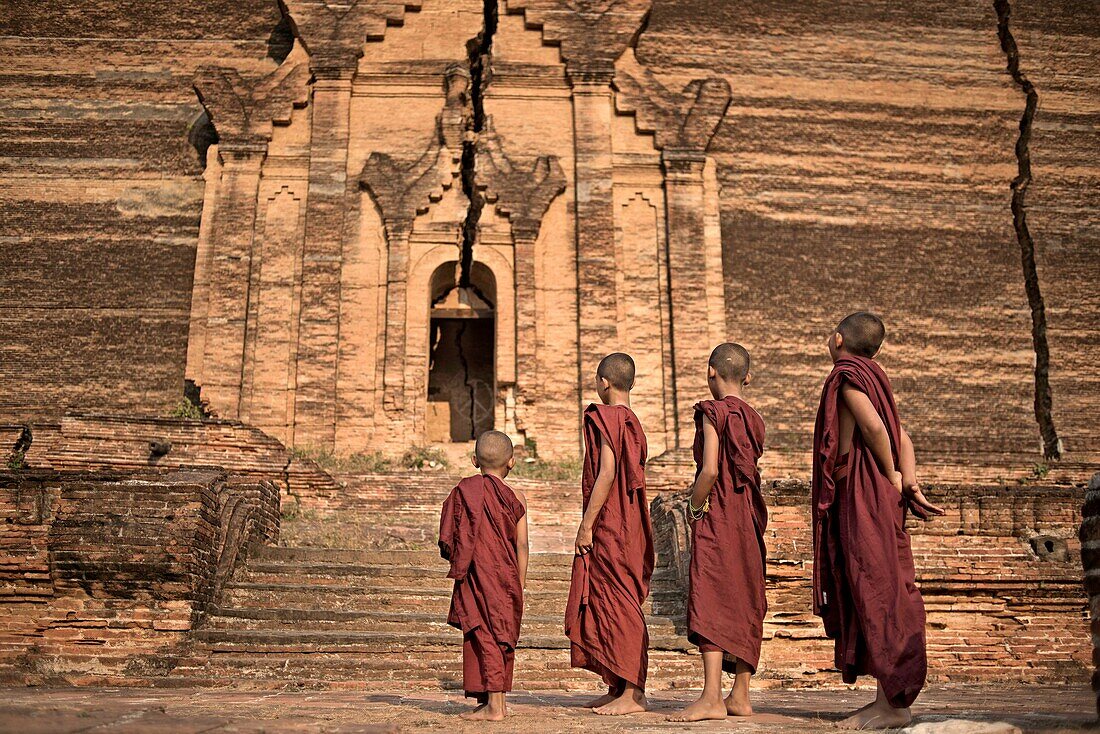 A group of young novice Buddhist monks at the Mingun Pagoda. Mingun, Sagaing, Myanmar.